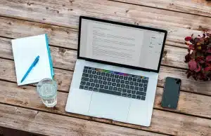 A Laptop on the Wooden Table Creating a Referenced Blog