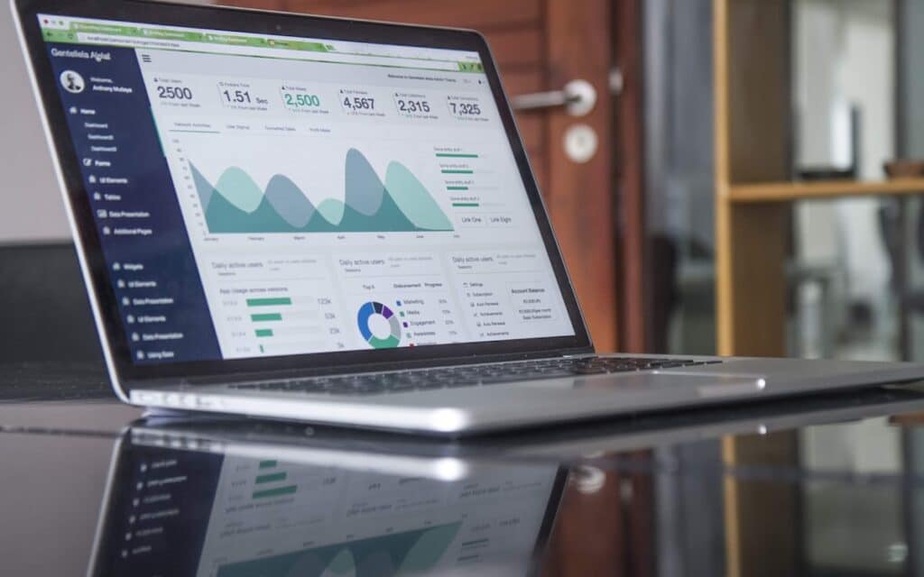 A laptop on a glass desk, representing a Melbourne trade business reviewing its Google Ads spend