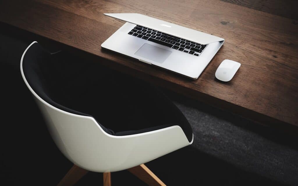 A laptop on a tidy desk representing a Melbourne trade business handling quotes, invoices and follow-ups with automation